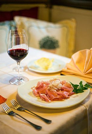 Ham of Sauris, a typical dish served at the restaurant alla Pace of Sauris