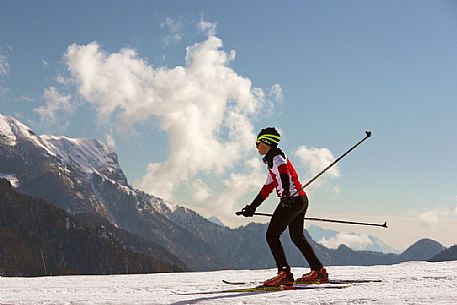 Cross-country skiing on the slopes of Sauris di Sopra , in the background the Monte Bivera , Sauris Cross-country skiing on the slopes of Sauris di Sopra , in the background the Monte Bivera , Sauris