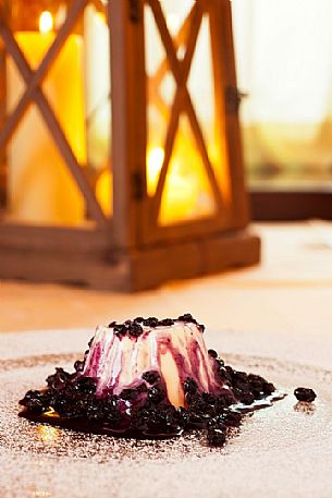 Panna cotta with blueberries, typical dessert of Morgenleit restaurant, Sauris