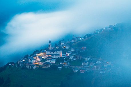 The alpine village of Casamazzagno in the evening, Comelico, dolomites, Italy