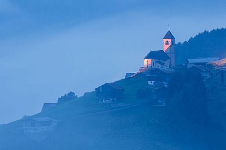 The old and little village of San Leonardo Vecchio in the evening, Comelico, dolomites, Italy