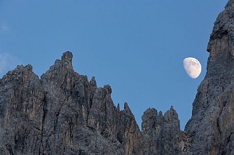 The moon rises on the Popera spiers in the Sesto Dolomites, from Berti refuge, Cadore, dolomites, Italy