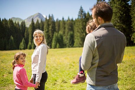 A family walks in Val Visdende, Cadore, Italy