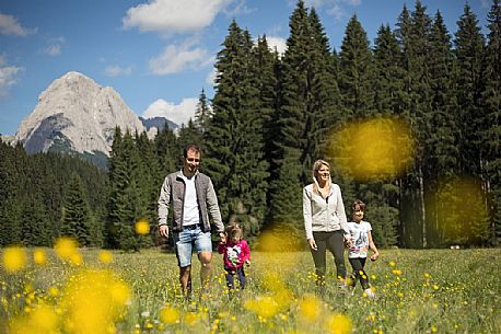 A family walks in Val Visdende, Visdende valley, dolomites, Italy
