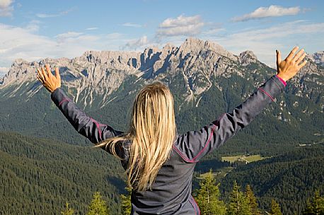 Hiker looks at the landscape from Val Visdende, Comelico, Italy Hiker looks at the landscape from Val Visdende, Comelico, Italy