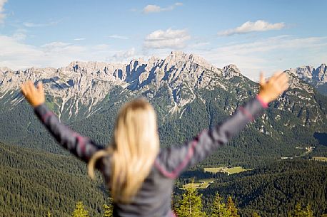 Hiker looks at the landscape from Val Visdende, Comelico, Italy Hiker looks at the landscape from Val Visdende, Comelico, Italy
