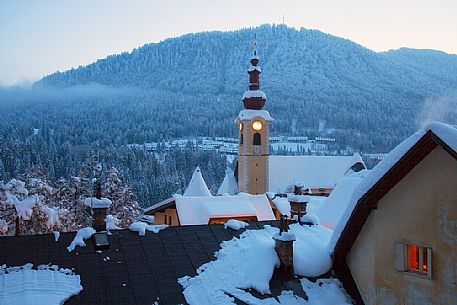 Tarvisio's church after an heavy snowfall. Tarvisio in an alpine town near the border with Austria and Slovenia