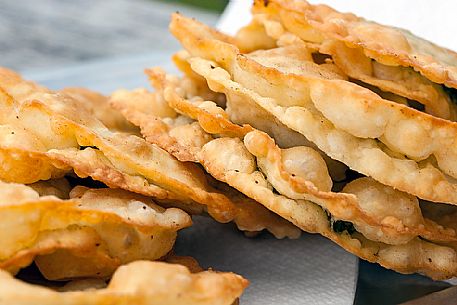 Turtres (pancakes stuffed with cheese and spinach), traditional ladin food, South Tyrol, Dolomites, Italy 