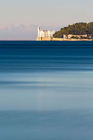 Miramare castle, in the backgrund the Julian Alps, Trieste, Italy Miramare castle, in the backgrund the Julian Alps, Trieste, Italy
