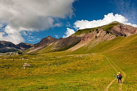 Hikers in the solitary Pian della Nana, Brenta dolomites, Trentino, Italy