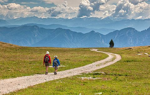 Hikers in the solitary Pian della Nana, Brenta dolomites, Trentino, Italy Hikers in the solitary Pian della Nana, Brenta dolomites, Trentino, Italy