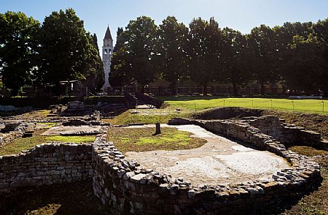 Archaeological area of Aquileia and in background the Basillica's bell tower, Italy Archaeological area of Aquileia and in background the Basillica's bell tower, Italy