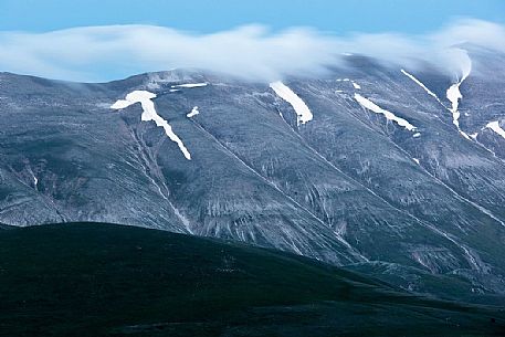 Evening clouds above Monte Vettore mountain, Castelluccio di Norcia, Italy