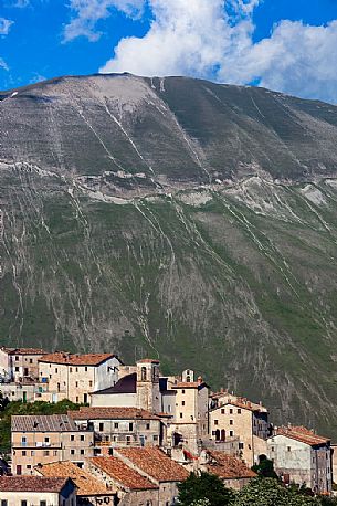 The old village of Castelluccio di Norcia before the disastrous earthquake of 2016 ant in the background the mount Vettore and its fault, Italy