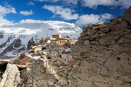 Castelluccio di Norcia, the old village destroyed by the earthquake of 2016, in the background the Vettore montain and its fault, Sibillini national park, Italy