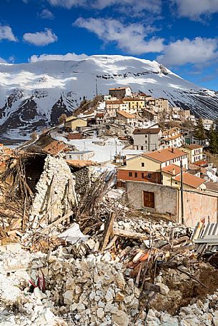 Castelluccio di Norcia, the old village destroyed by the earthquake of 2016, in the background the Vettore montain and its fault, Sibillini national park, Italy