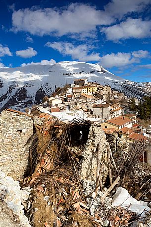 Castelluccio di Norcia, the old village destroyed by the earthquake of 2016, in the background the Vettore montain and its fault, Sibillini national park, Italy