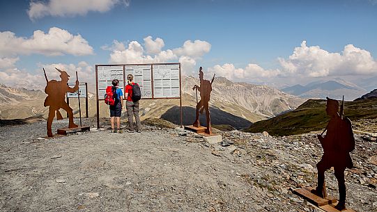 Hikers at Garibaldi peak or Dreisprachenspitze, in the background the swiss alps, Stelvio pass, Stelvio national park, Italy Hikers at Garibaldi peak or Dreisprachenspitze, in the background the swiss alps, Stelvio pass, Stelvio national park, Italy