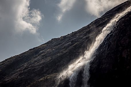 Waterfall in Martello valley along the glacial path , Stelvio national park, Italy Waterfall in Martello valley along the glacial path , Stelvio national park, Italy