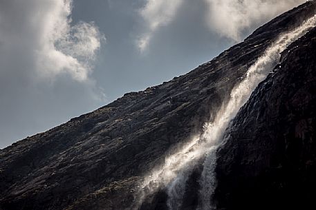 Waterfall in Martello valley along the glacial path , Stelvio national park, Italy