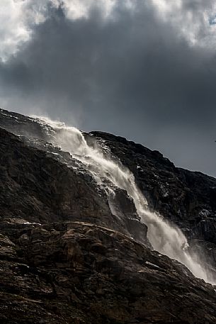 Waterfall in Martello valley along the glacial path , Stelvio national park, Italy