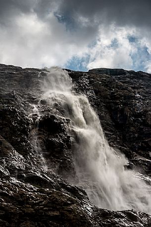 Waterfall in Martello valley along the glacial path , Stelvio national park, Italy Waterfall in Martello valley along the glacial path , Stelvio national park, Italy