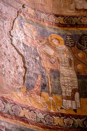 Ancient fresco in the Benedictine convent of Saint John (UNESCO world heritage site), in Monastery valley Mustair, Switzerland Ancient fresco in the Benedictine convent of Saint John (UNESCO world heritage site), in Monastery valley Mustair, Switzerland
