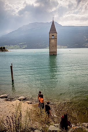 The bell tower in the Resia lake, South Tyrol, Italy