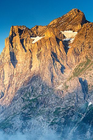 Sunset on Jungfrau mountain group from Grindelwald village, Berner Oberland, Switzerland, Europe Sunset on Jungfrau mountain group from Grindelwald village, Berner Oberland, Switzerland, Europe