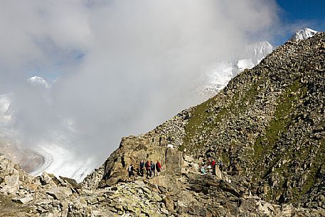 Hikers alogn the path to Eggishorn mountain,  Aletsch glacier, Fiesch, Valais, Switzerland, Europe