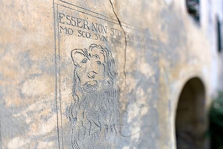 Detail of sgraffito in the old house of Guarda, a tipical village with houses ornated with old painted stone 17th Century buildings, Scuol, Engadine, Graubunden, Switzerland, Europe
 