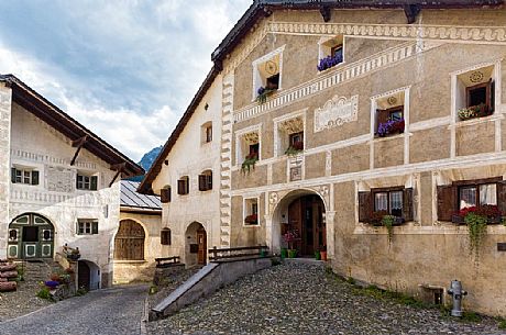 Old house in Guarda a tipical village with houses ornated with old painted stone 17th Century buildings, Scuol, Engadine, Canton of Grisons, Switzerland, Europe