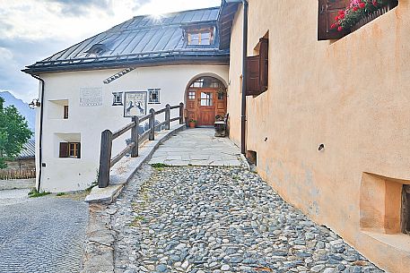 Old house in Guarda a tipical village with houses ornated with old painted stone 17th Century buildings, Scuol, Engadine, Canton of Grisons, Switzerland, Europe Old house in Guarda a tipical village with houses ornated with old painted stone 17th Century buildings, Scuol, Engadine, Canton of Grisons, Switzerland, Europe