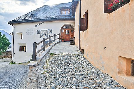 Old house in Guarda a tipical village with houses ornated with old painted stone 17th Century buildings, Scuol, Engadine, Canton of Grisons, Switzerland, Europe