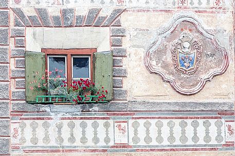 Detail of old house frescoed in the Ardez village, a little village with painted 17th Century houses, Low Engadin, Canton of Grisons, Switzerland, Europe