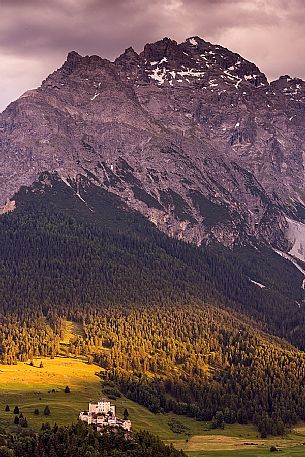 Tarasp Castle at sunset and Mountain of Swiss national park, Lower Engadin, Canton of Grisons, Switzerland, Europe Tarasp Castle at sunset and Mountain of Swiss national park, Lower Engadin, Canton of Grisons, Switzerland, Europe