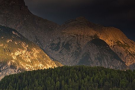 Detail of mountains of national park swiss at sunset next to Scuol, low engadin, canton of Grisons, Switzerland, Europe Detail of mountains of national park swiss at sunset next to Scuol, low engadin, canton of Grisons, Switzerland, Europe
