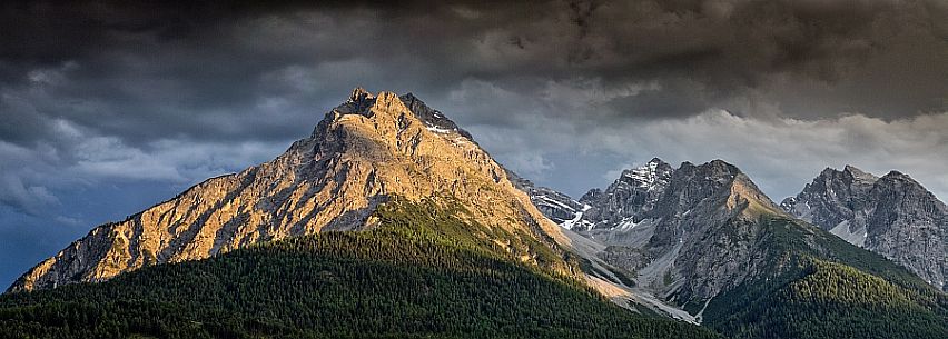 The mountains of national park swiss at sunset next to Scuol, low engadin, canton of Grisons, Switzerland, Europe