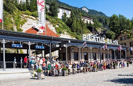 Tourists at the,Valley Staion of the Pilatus Cogwheel Railway, Alpnachstad, Lucerne, Switzerland, Europe Tourists at the,Valley Staion of the Pilatus Cogwheel Railway, Alpnachstad, Lucerne, Switzerland, Europe