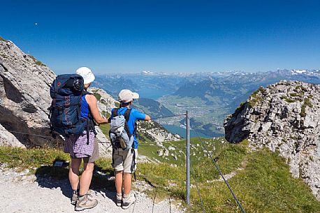 Hikers on the Pilatus mountainn area, in the background the Lucerne lake,  Border Area between the Cantons of Lucerne, Nidwalden and Obwalden, Switzerland, Europe