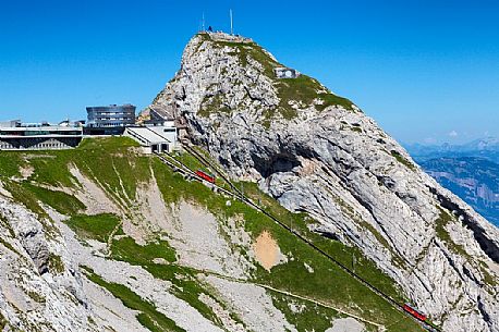 The red Cogwheel Railway arriving at the Pilatus Mountain station, Border Area between the Cantons of Lucerne, Nidwalden and Obwalden, Switzerland, Europe