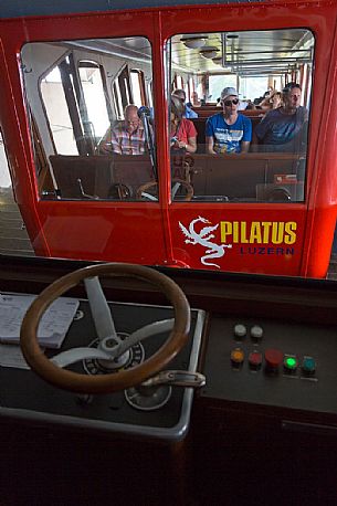 Tourists inside the Cogwheel Railway going up Pilatus Mountain, Border Area between the Cantons of Lucerne, Nidwalden and Obwalden, Switzerland, Europe