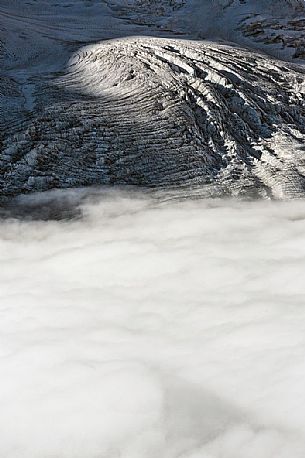 Detail of Gorner glacier in the fog from Gornergrat top, Monte Rosa or Breithorn mountain range, Zermatt, Valais, Switzerland, Europe
 