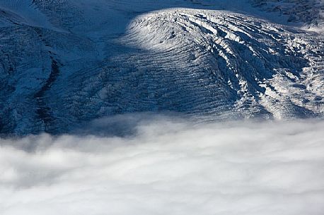 Detail of Gorner glacier in the fog from Gornergrat top, Monte Rosa or Breithorn mountain range, Zermatt, Valais, Switzerland, Europe
 