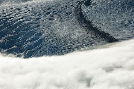 Detail of Gorner glacier in the fog from Gornergrat top, Monte Rosa or Breithorn mountain range, Zermatt, Valais, Switzerland, Europe
 