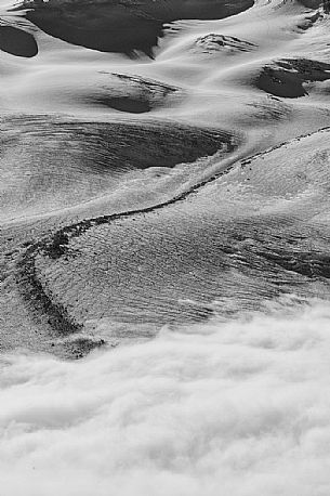 Detail of Gorner glacier in the fog from Gornergrat top, Monte Rosa or Breithorn mountain range, Zermatt, Valais, Switzerland, Europe
 