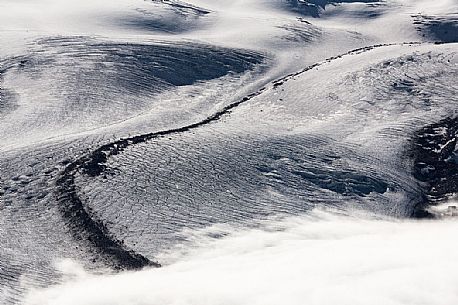 Detail of Gorner glacier in the fog from Gornergrat top, Monte Rosa or Breithorn mountain range, Zermatt, Valais, Switzerland, Europe
 