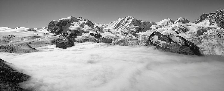View from Gornergrat mountain towards Monte Rosa or Breithorn mountain range and the Gorner glacier in the fog, Zermatt, Valais, Switzerland, Europe
View from Gornergrat mountain towards Monte Rosa or Breithorn mountain range and the Gorner glacier in the fog, Zermatt, Valais, Switzerland, Europe