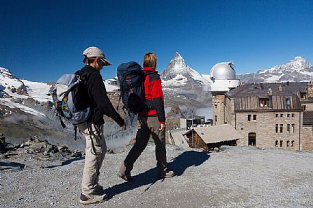 Hikers at the Gornergrat, in the background the Matterhorn or Cervino mount and the Kulm hotel with the astronomic observatory, Zermatt, Valais, Switzerland, Europe
Hikers at the Gornergrat, in the background the Matterhorn or Cervino mount and the Kulm hotel with the astronomic observatory, Zermatt, Valais, Switzerland, Europe