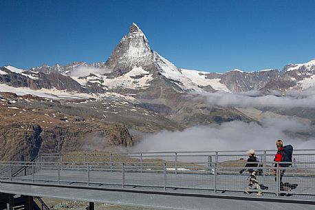 Hikers at the Gornergrat, in the background the Matterhorn or Cervino mount, Zermatt, Valais, Switzerland, Europe
